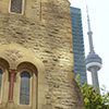front view of the side of St. Andrews church on King Street, with the CN tower in the background.  