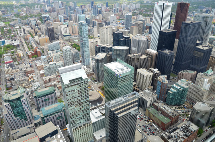 view from the CN tower, looking down over the city towards the north.  Lots of tall buildings. 