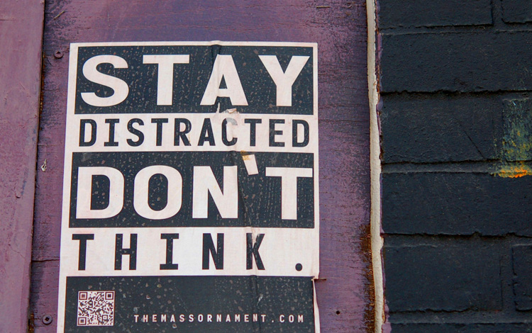 poster that says not to think but to stay distracted