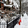 a view of a residential street in the winter