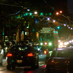 streetcar and cars in the rain at night 
