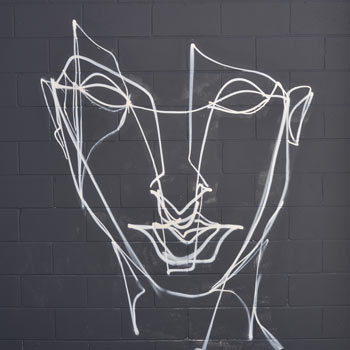 white line drawing of a face on a grey wall, by Anser 
