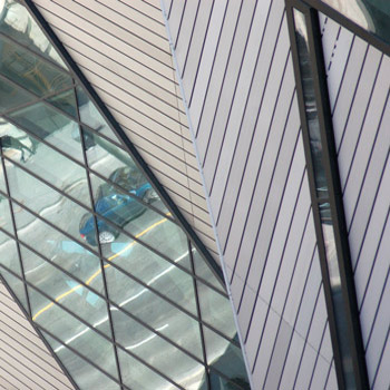 reflections in the window of the new crystal-like structure at the front of the Royal Ontario Museum 