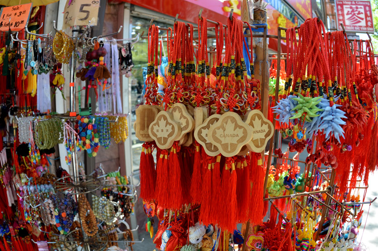 Good luck charms in red, Canadian souveniers, and other items for sale outside a store in Chinatown