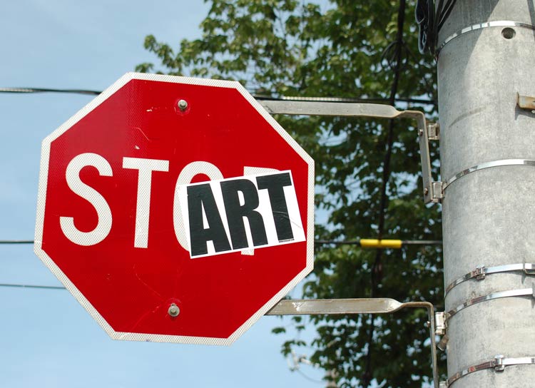 a stop sign that has had the word art added to it.  Now the sign says start