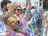 two very happy colourful woman cheering 