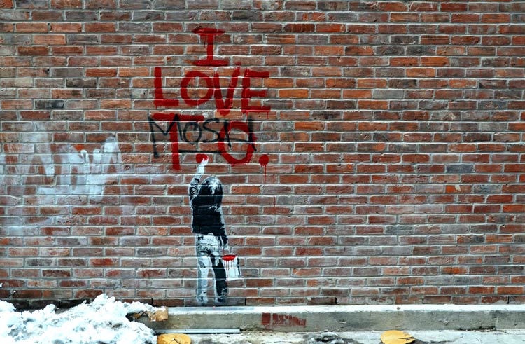 I love TO graffiti on a brick wall. 