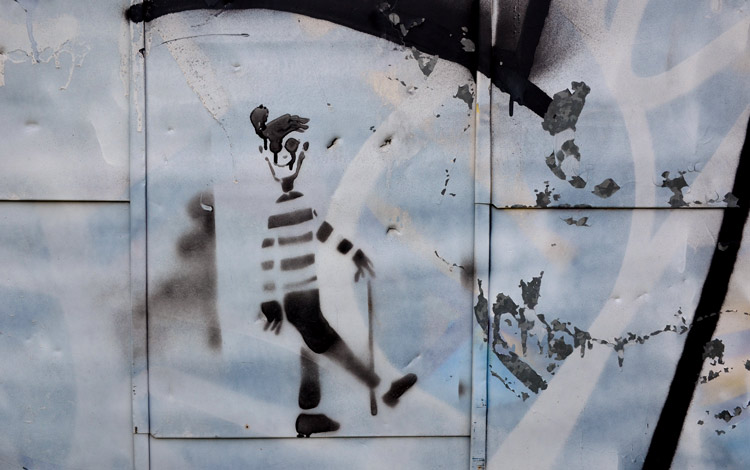 stencil graffiti of Waldo, the character from the books Where's Waldo?